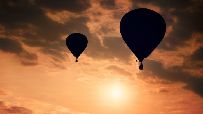 awesome-tech-stories-hot-air-balloons-silhouette-against-sunny