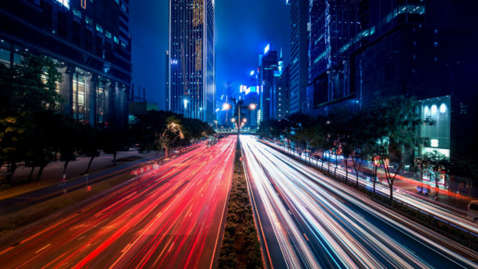 autonomous-vehicles-cars-blurred-hong-kong-city-street-view-night