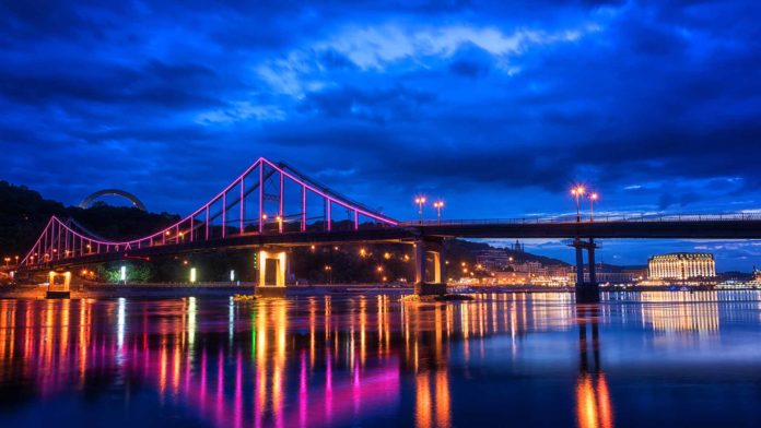 City in Ukraine bridge with colorful lights at night