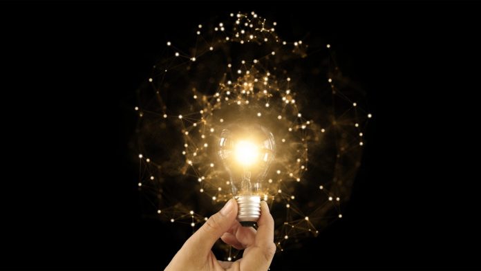 lightbulb with particles innovation future technology
