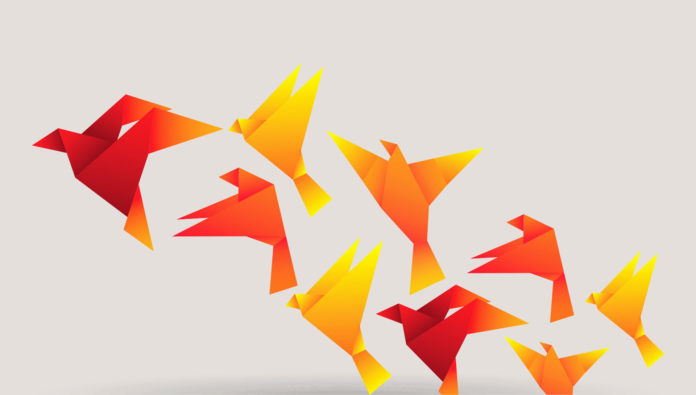 orange origami birds flying
