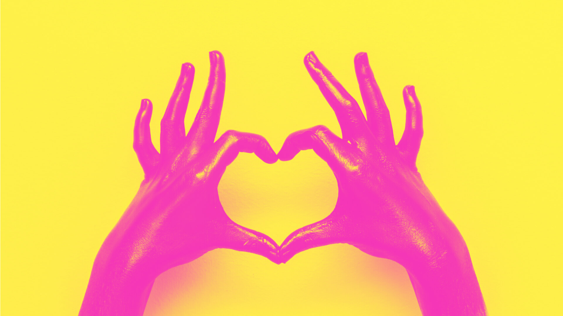 pink-hands-heart-sign-yellow-background-shutterstock_1038669985 -  Singularity Hub