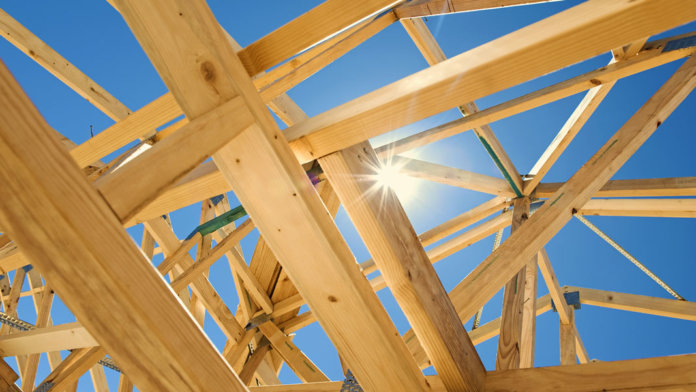 home framing with blue sky and sun background future of energy