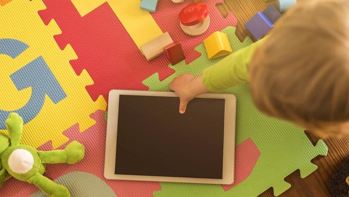 toddler pick up tablet generation growing with artificial intelligence