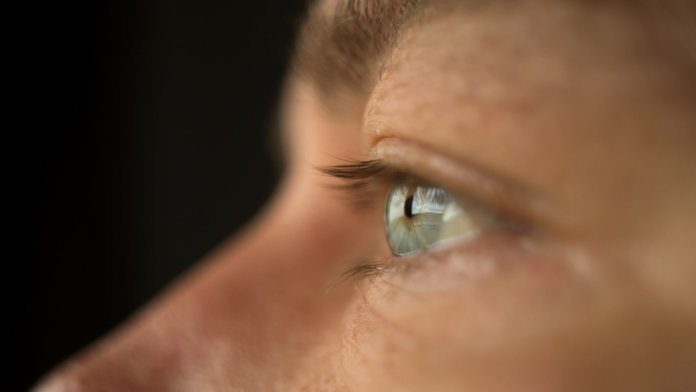 CRISPR Close up of a man's blue eye