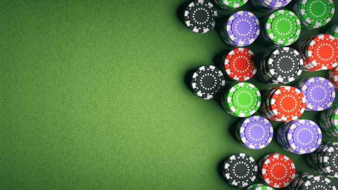 Casino poker chips on green felt background artificial intelligence