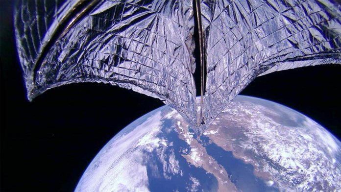 LIghtsail 2 with sail and earth as background in space