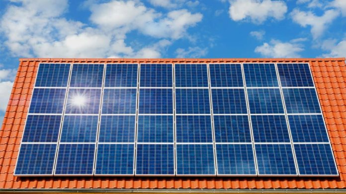 solar panels on roof reflecting sun energy