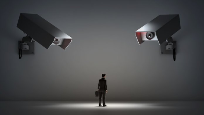 man and surveillance cameras privacy issue concept bitcoin