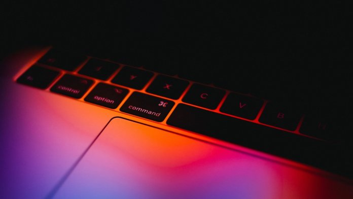 digital learning apple mac laptop computer keyboard colors black background