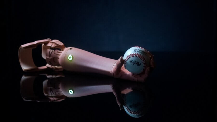 Unlimited Tomorrow 3d printed prosthetics arm on black background