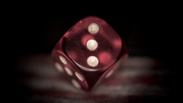 deepmind ai red dice black background probability