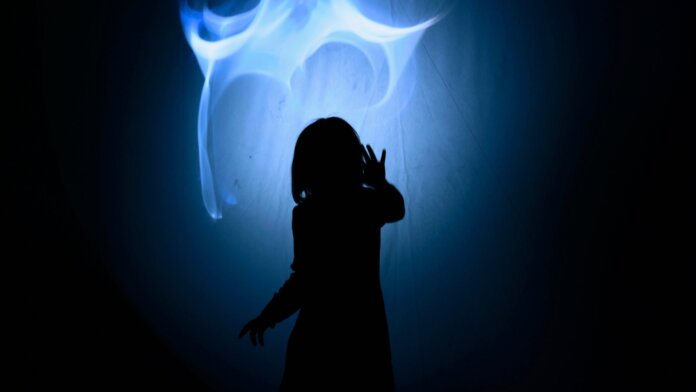 tech stories blue glowing light person sillhouette dark background