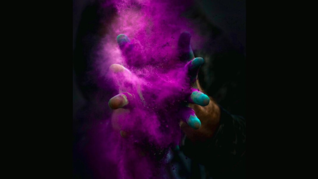 tech stories hands purple powder explosion black background enhanced