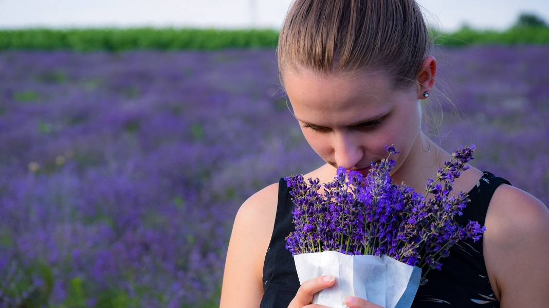 girl smelling lavender nose