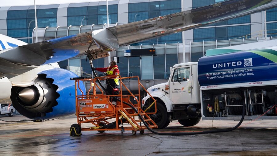 SAF sustainable jet fuel United plane on tarmac