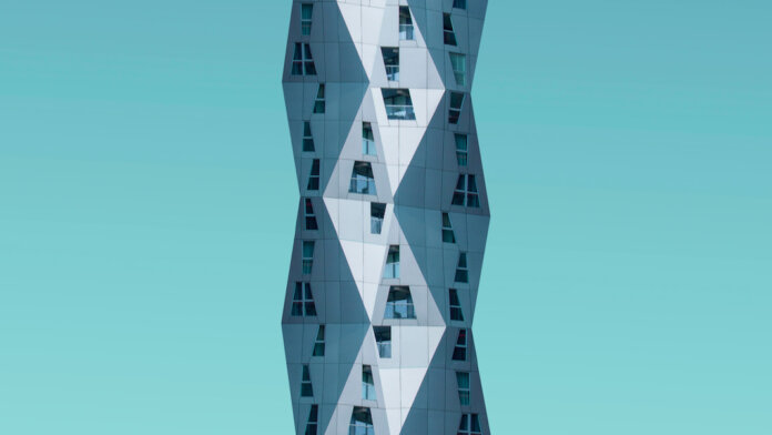 tech stories geometric architecture building blue green sky