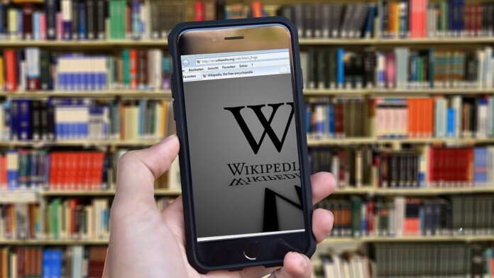 Meta Wikipedia fact checking bot books on library shelf
