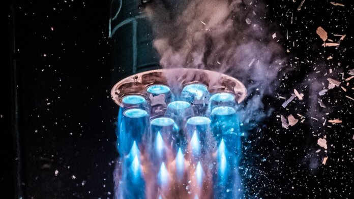 relativity space terran 1 3d-printed rocket night launch blue exhaust