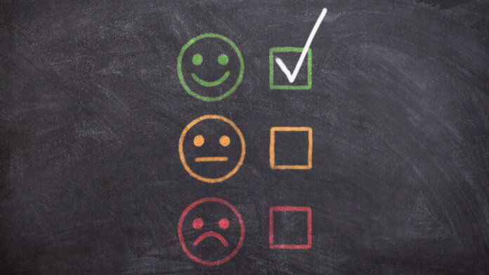 generative AI worker satisfaction feedback emoji on a chalkboard