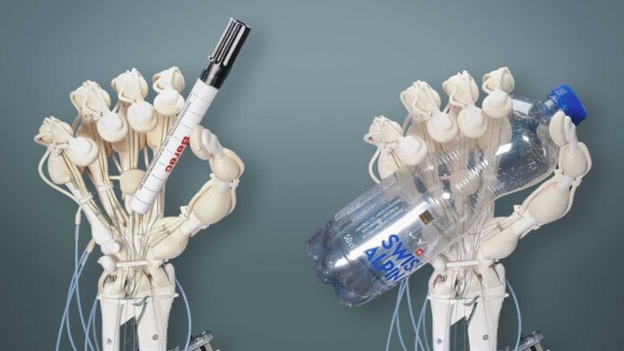 robotic hand grasping objects like a pen and plastic bottle
