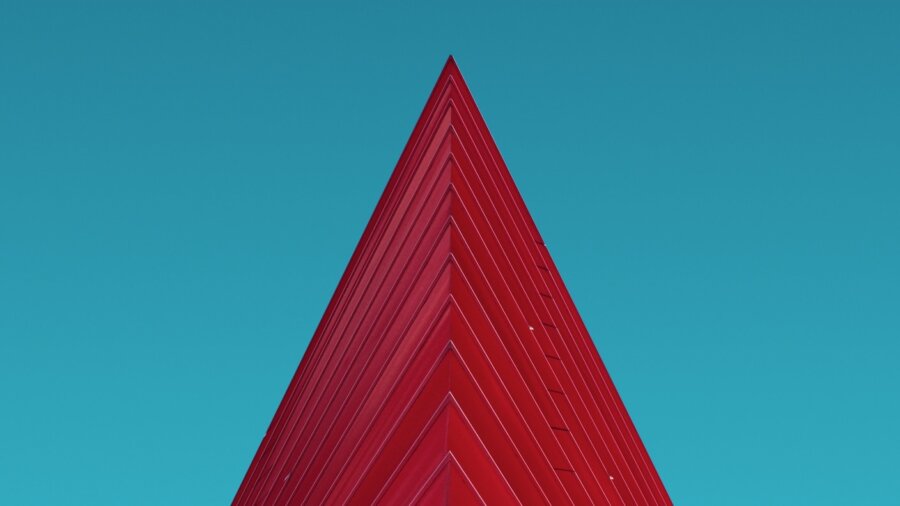 red architecture building triangle blue sky